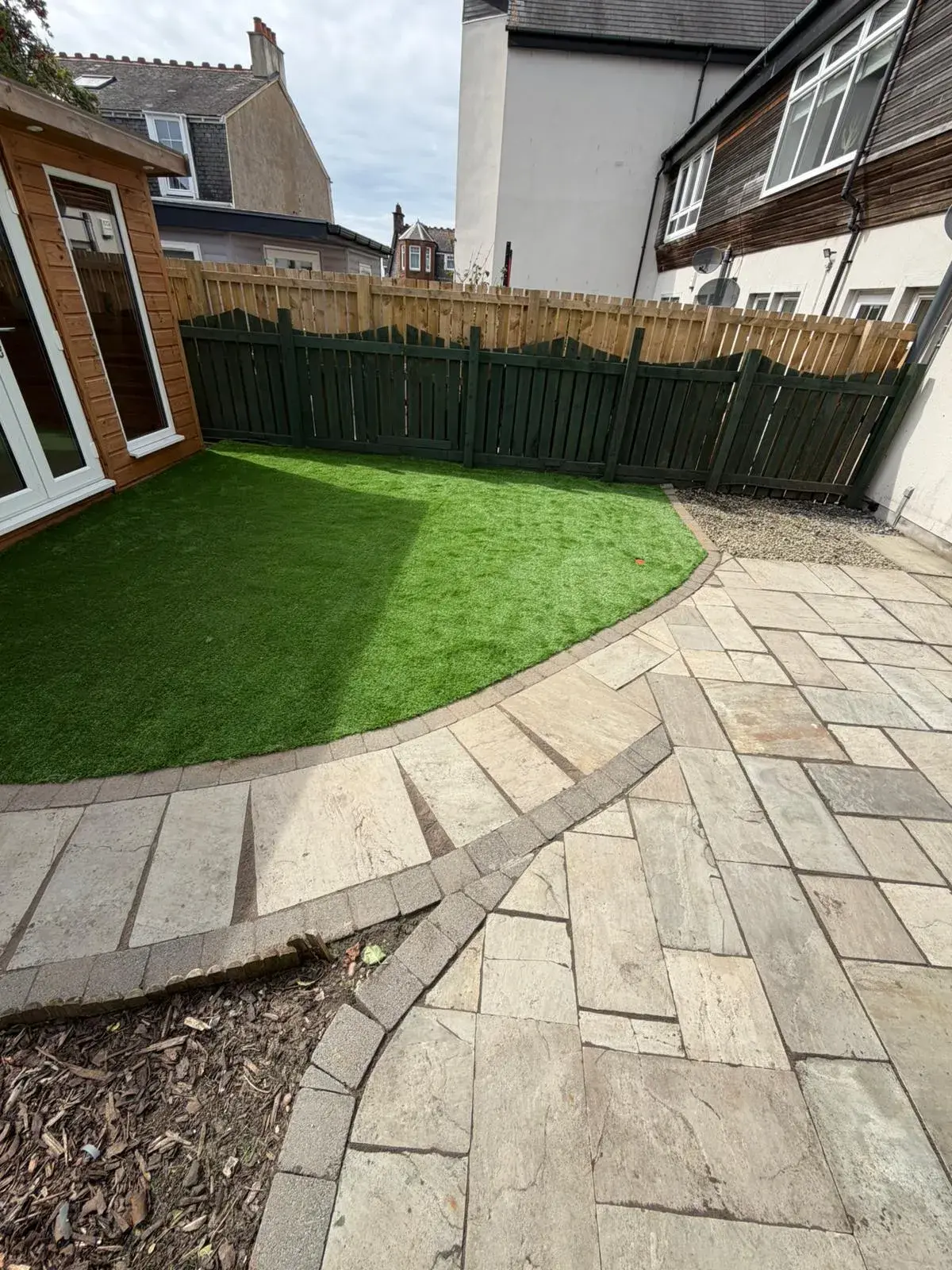 A completed Riverside Landscaping porcelain patio installation